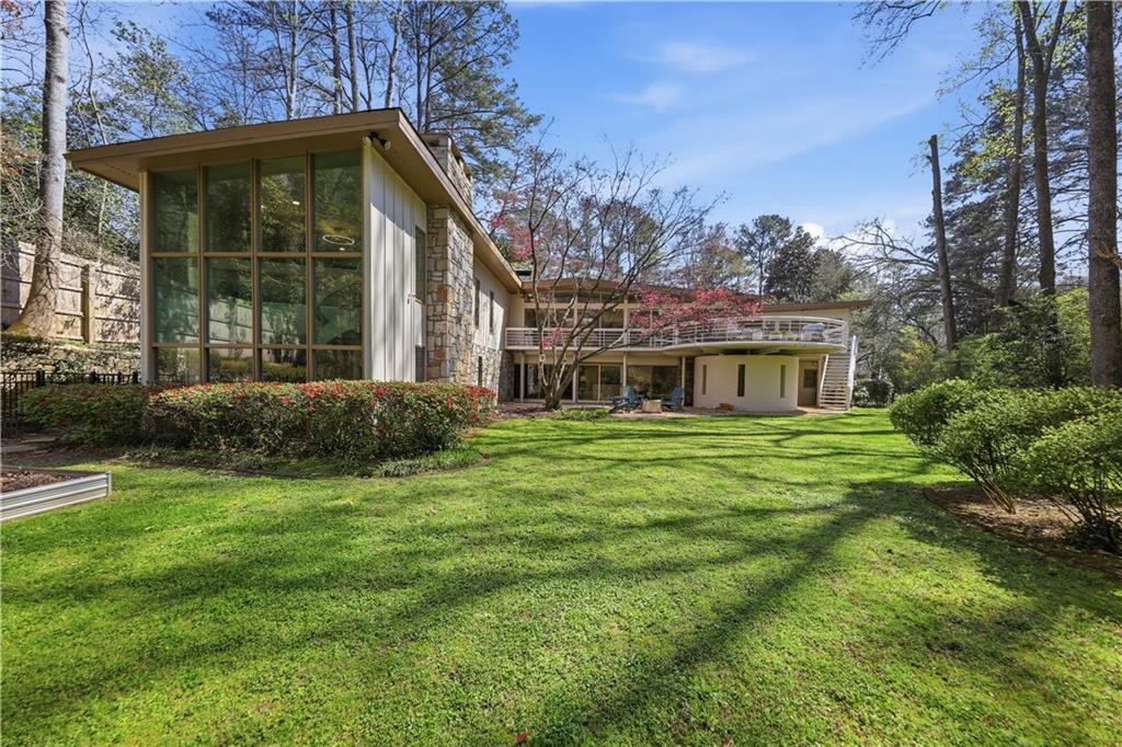 505 Hollydale Court Northwest Atlanta, GA 30342 - Photo 92 of 117 a front view of a house with a garden