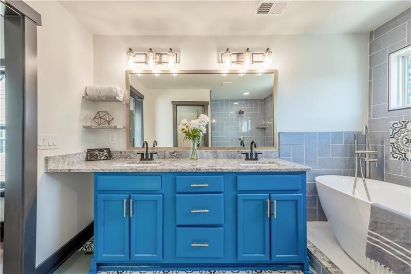 767 Terry Street Southeast, Unit B Atlanta, GA 30315 - Photo 11 of 37 a bathroom with a granite countertop sink mirror and bathtub