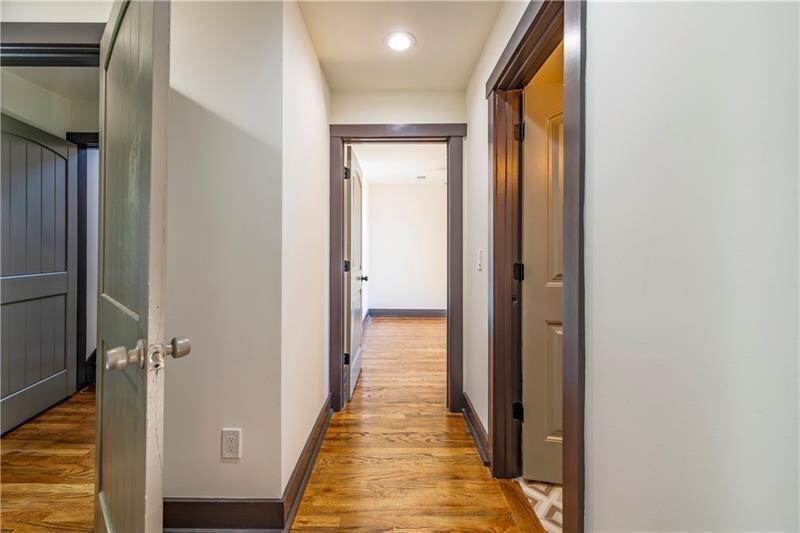 767 Terry Street Southeast, Unit B Atlanta, GA 30315 - Photo 15 of 37 a view of a hallway with wooden floor and staircase