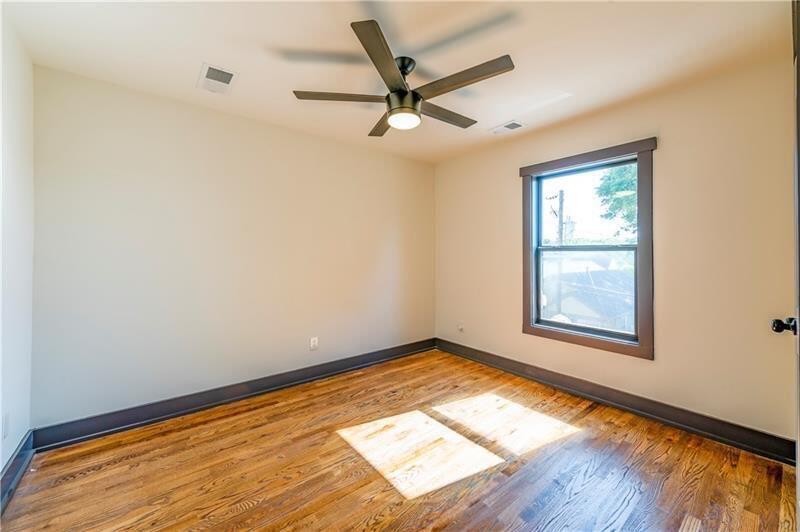 767 Terry Street Southeast, Unit B Atlanta, GA 30315 - Photo 16 of 37 a view of empty room with wooden floor and fan