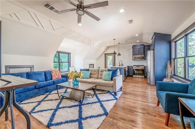 767 Terry Street Southeast, Unit B Atlanta, GA 30315 - Photo 20 of 37 a living room with fireplace furniture and a wooden floor