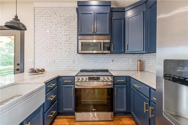 a kitchen with a stove and a microwave