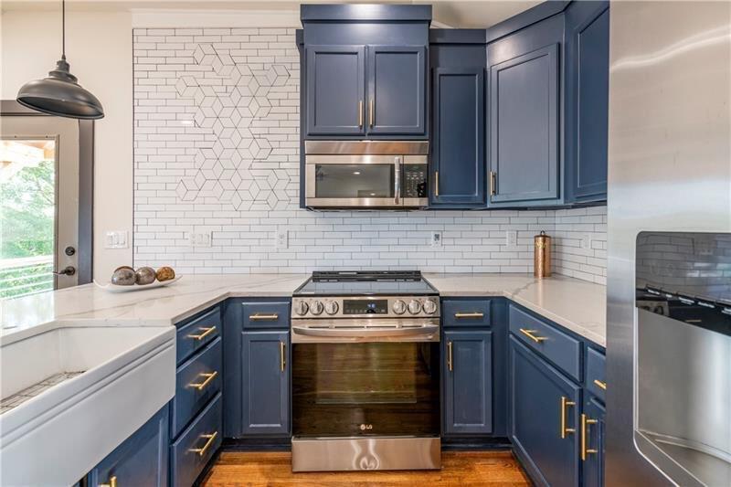 767 Terry Street Southeast, Unit B Atlanta, GA 30315 - Photo 27 of 37 a kitchen with a stove and a microwave