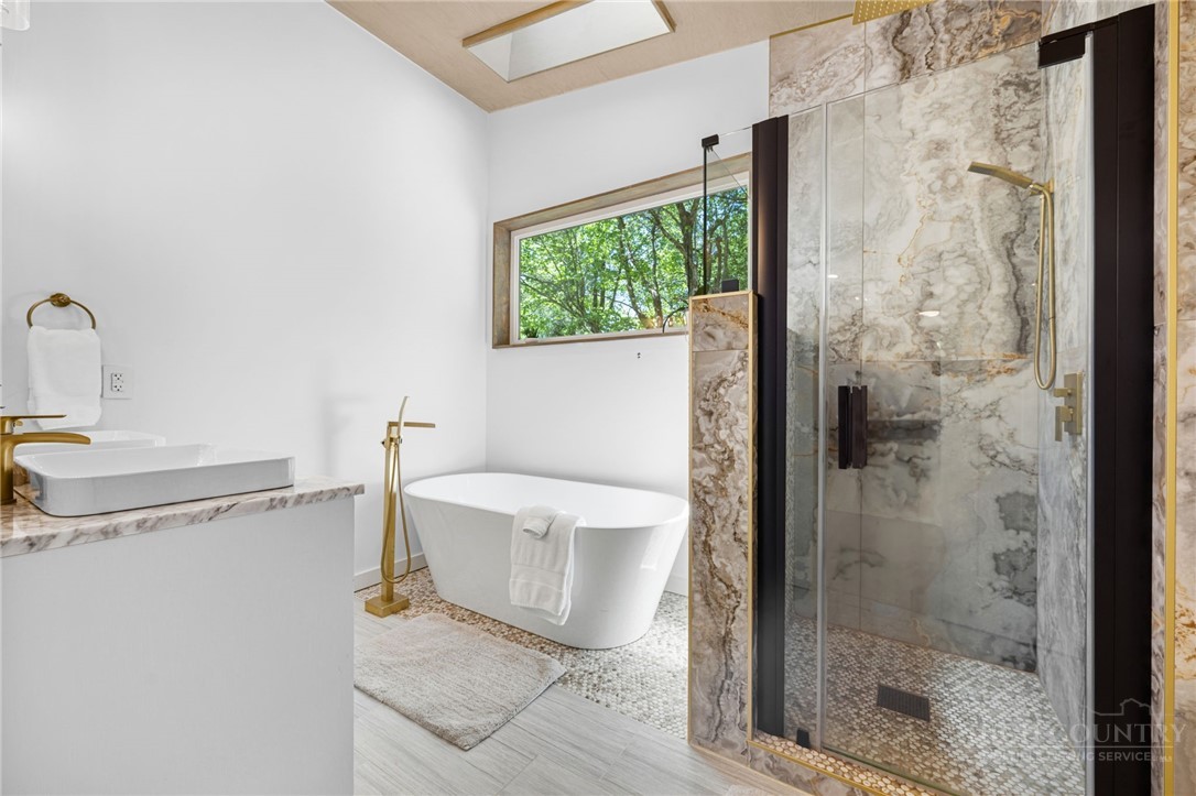 1385 Niley Cook Road Blowing Rock, NC 28605 - Photo 22 of 40 a bathroom with a sink and a shower