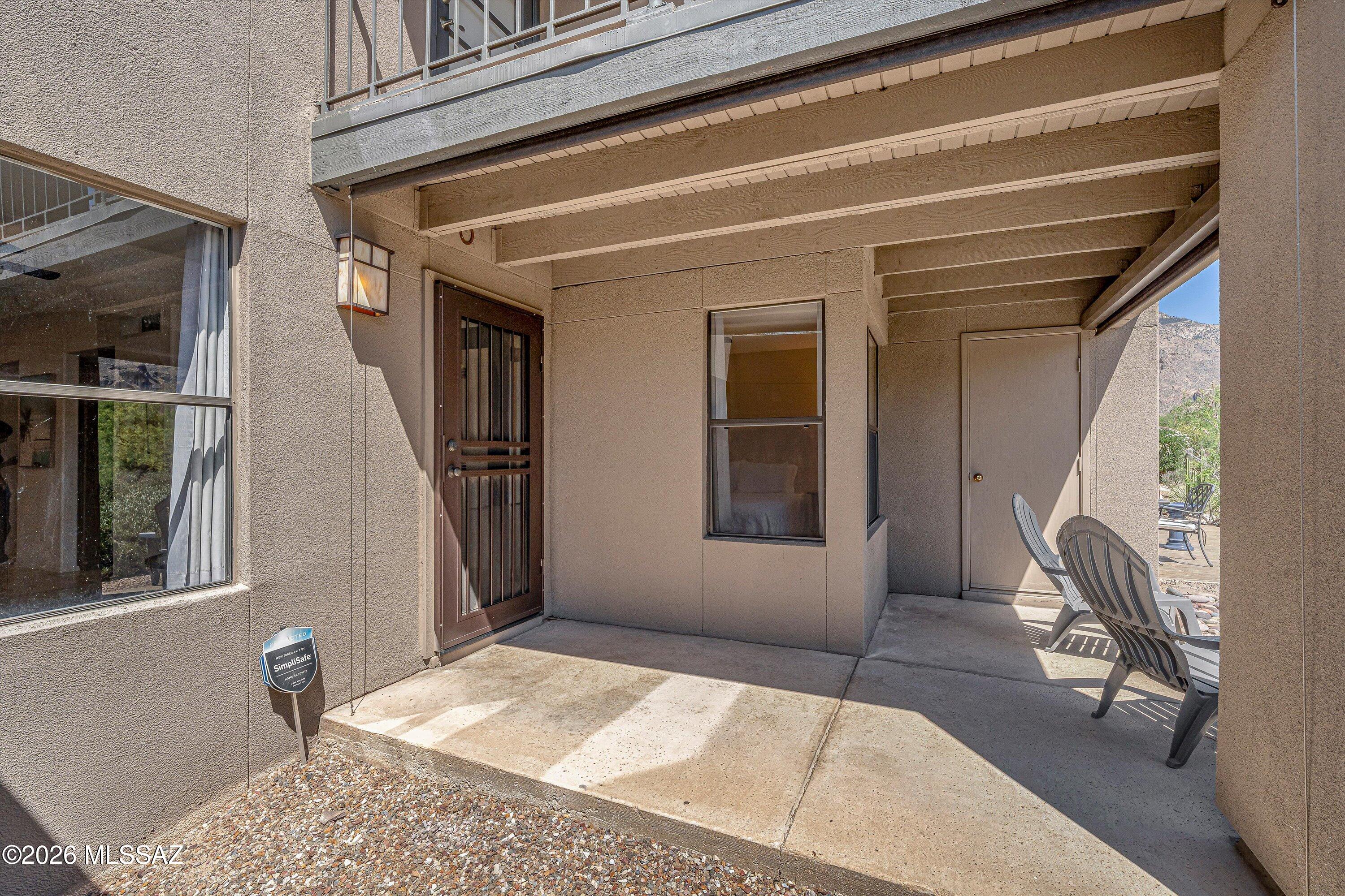 5800 North Kolb Road, Unit 5125 Tucson, AZ 85750 - Photo 25 of 34 a view of a hallway with a chair and dining table view