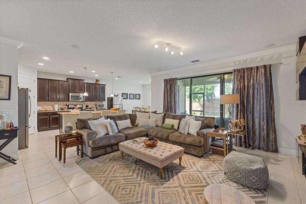 7180 Beek Street Windermere, FL 34786 - Photo 8 of 33 a living room with furniture and a large window
