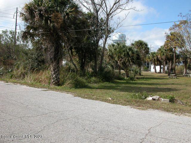 a view of a golf course with a house