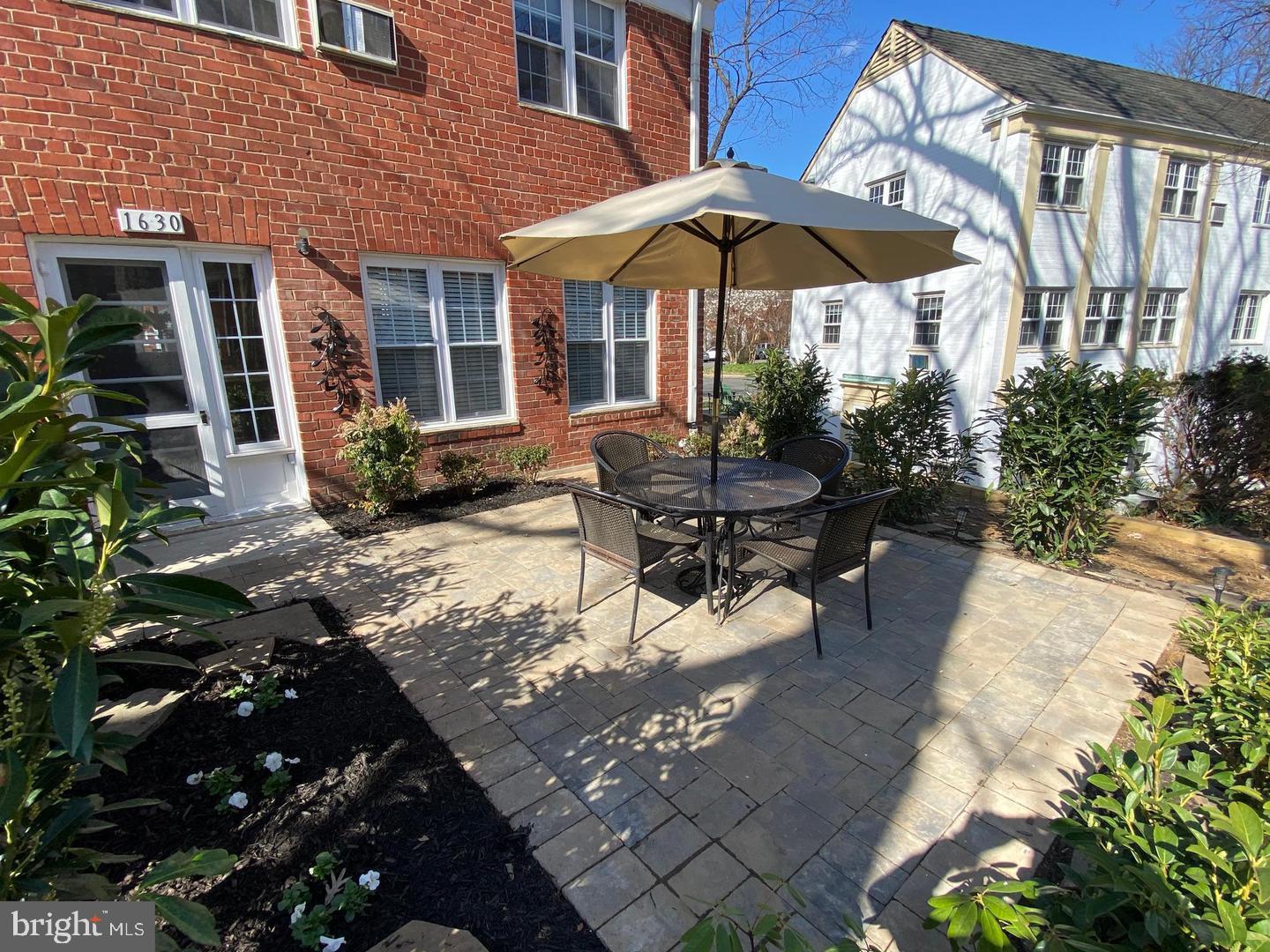 Large patio with landscaping