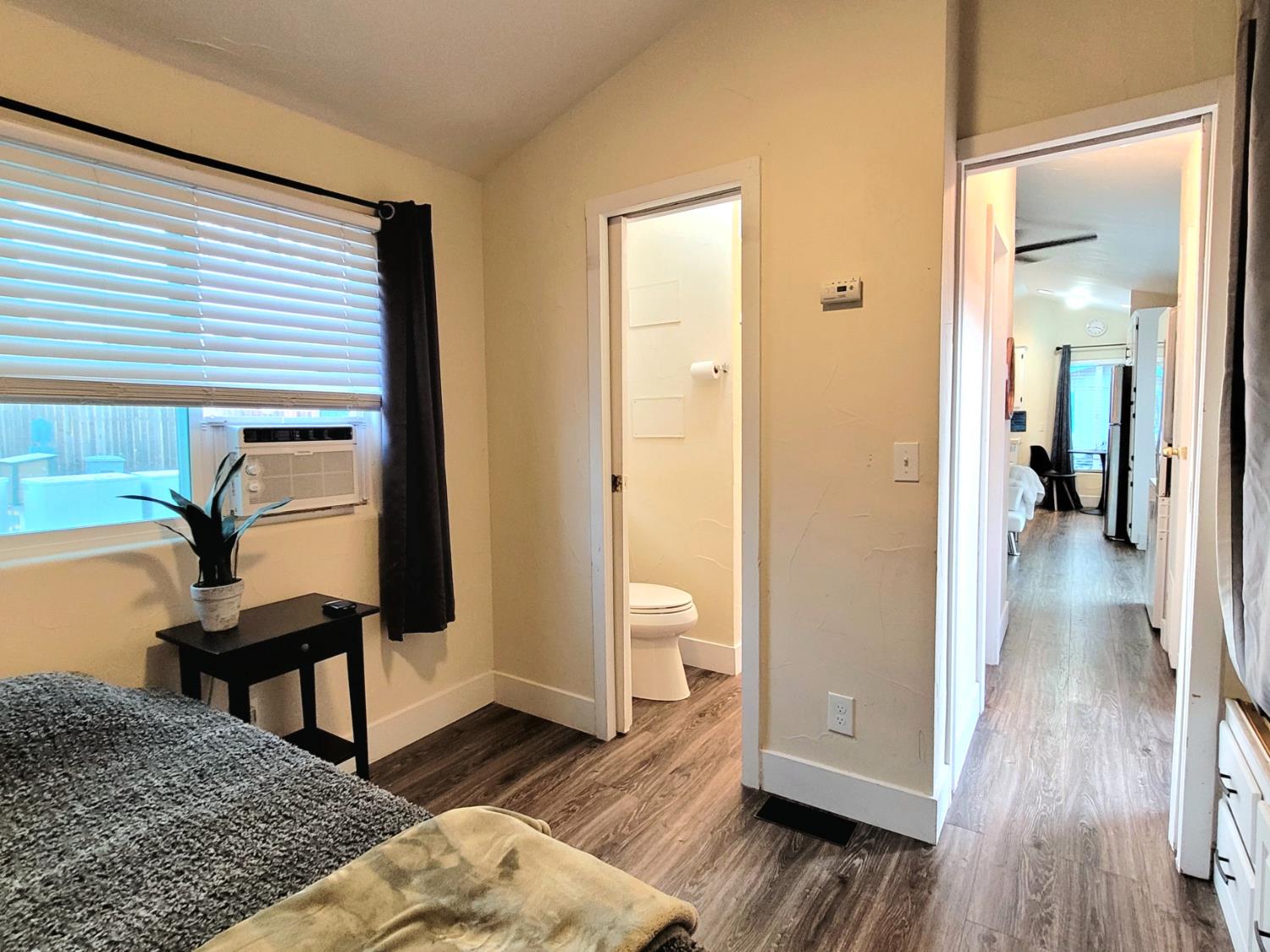 8880 Auburn Folsom Rd Road, Unit 25 Granite Bay, CA 95746 - Photo 13 of 19 a view of a hallway with wooden floor and a bathroom