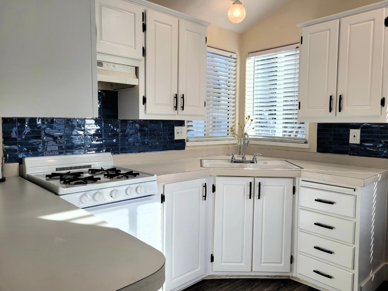8880 Auburn Folsom Rd Road, Unit 25 Granite Bay, CA 95746 - Photo 4 of 19 a kitchen with granite countertop a sink a stove and cabinets