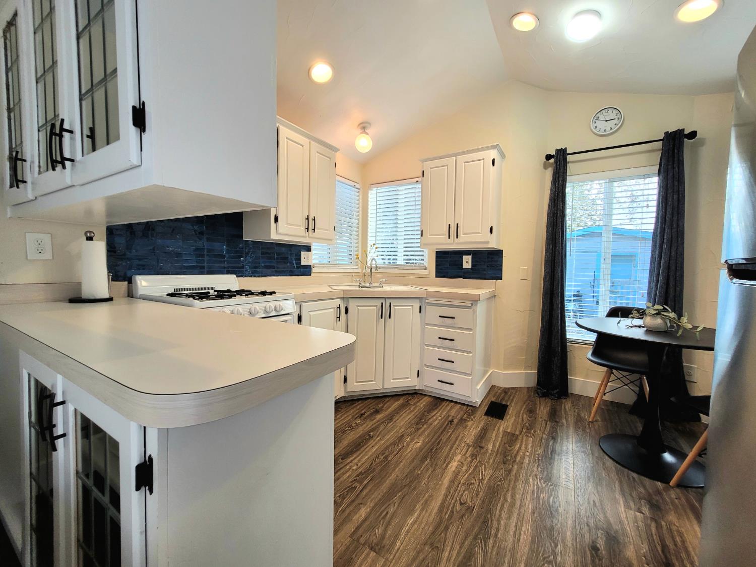 8880 Auburn Folsom Rd Road, Unit 25 Granite Bay, CA 95746 - Photo 7 of 19 a kitchen with a sink a stove and cabinets