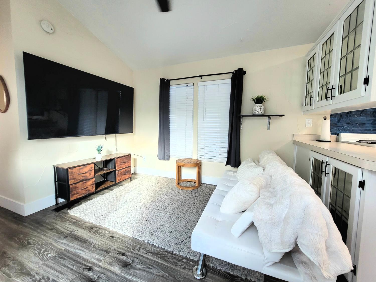 8880 Auburn Folsom Rd Road, Unit 25 Granite Bay, CA 95746 - Photo 9 of 19 a living room with furniture and a flat screen tv