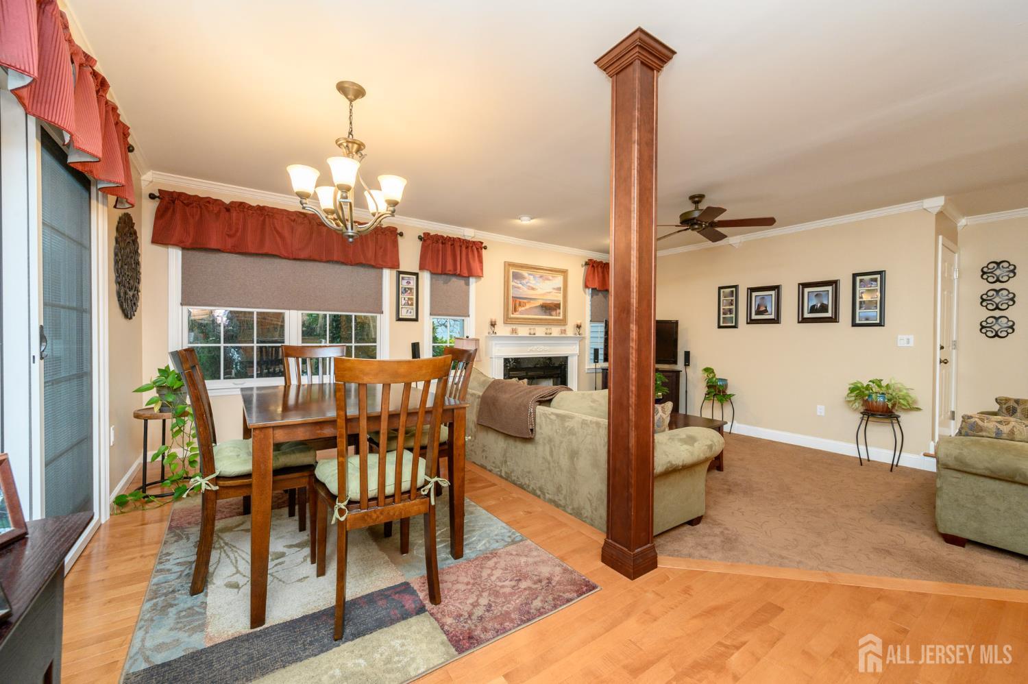 12 Diamond Lane Howell, NJ 07731 - Photo 14 of 47 a living room with furniture a chandelier and a dining table