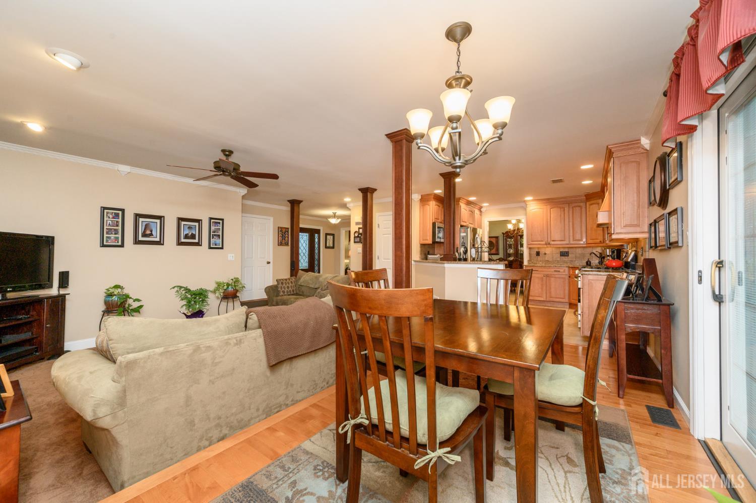 12 Diamond Lane Howell, NJ 07731 - Photo 16 of 47 a dining room with furniture and a chandelier