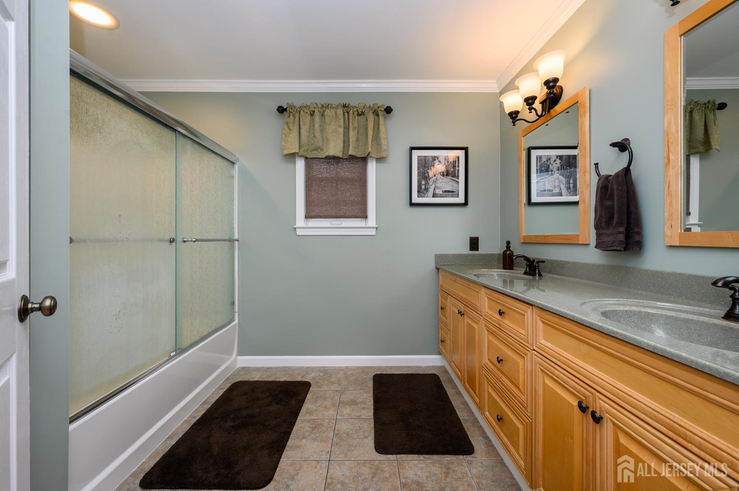 12 Diamond Lane Howell, NJ 07731 - Photo 24 of 47 a bathroom with a sink a mirror and a bathtub