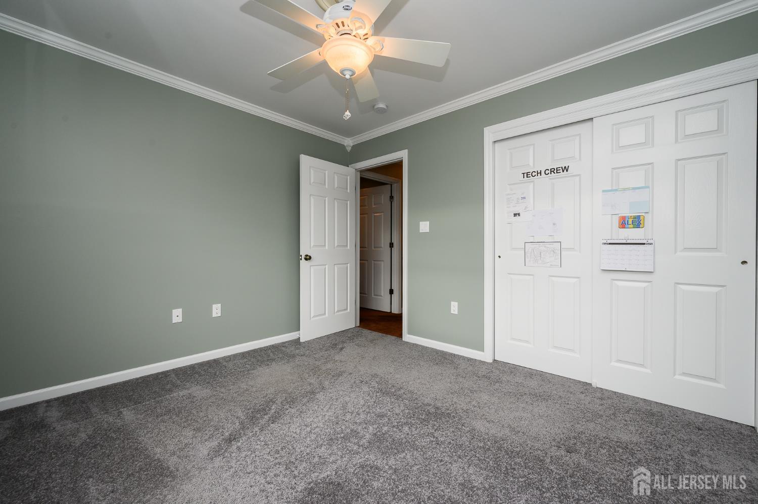 12 Diamond Lane Howell, NJ 07731 - Photo 29 of 47 an empty room with closet and a chandelier fan