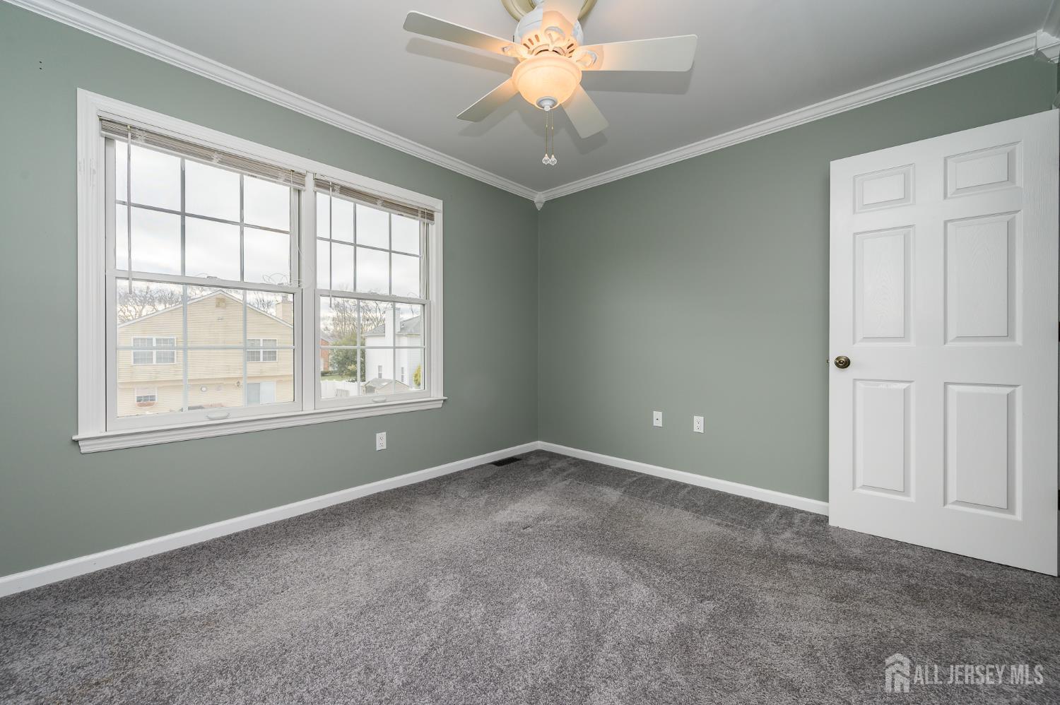 12 Diamond Lane Howell, NJ 07731 - Photo 30 of 47 an empty room with windows and fan