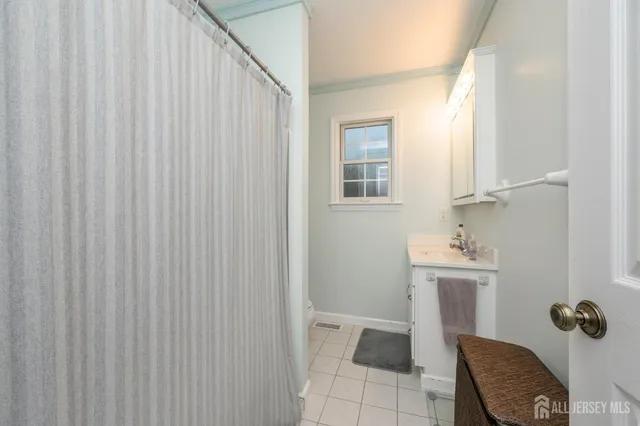 a view of a roof deck with table and chairs floor to ceiling window with wooden floor