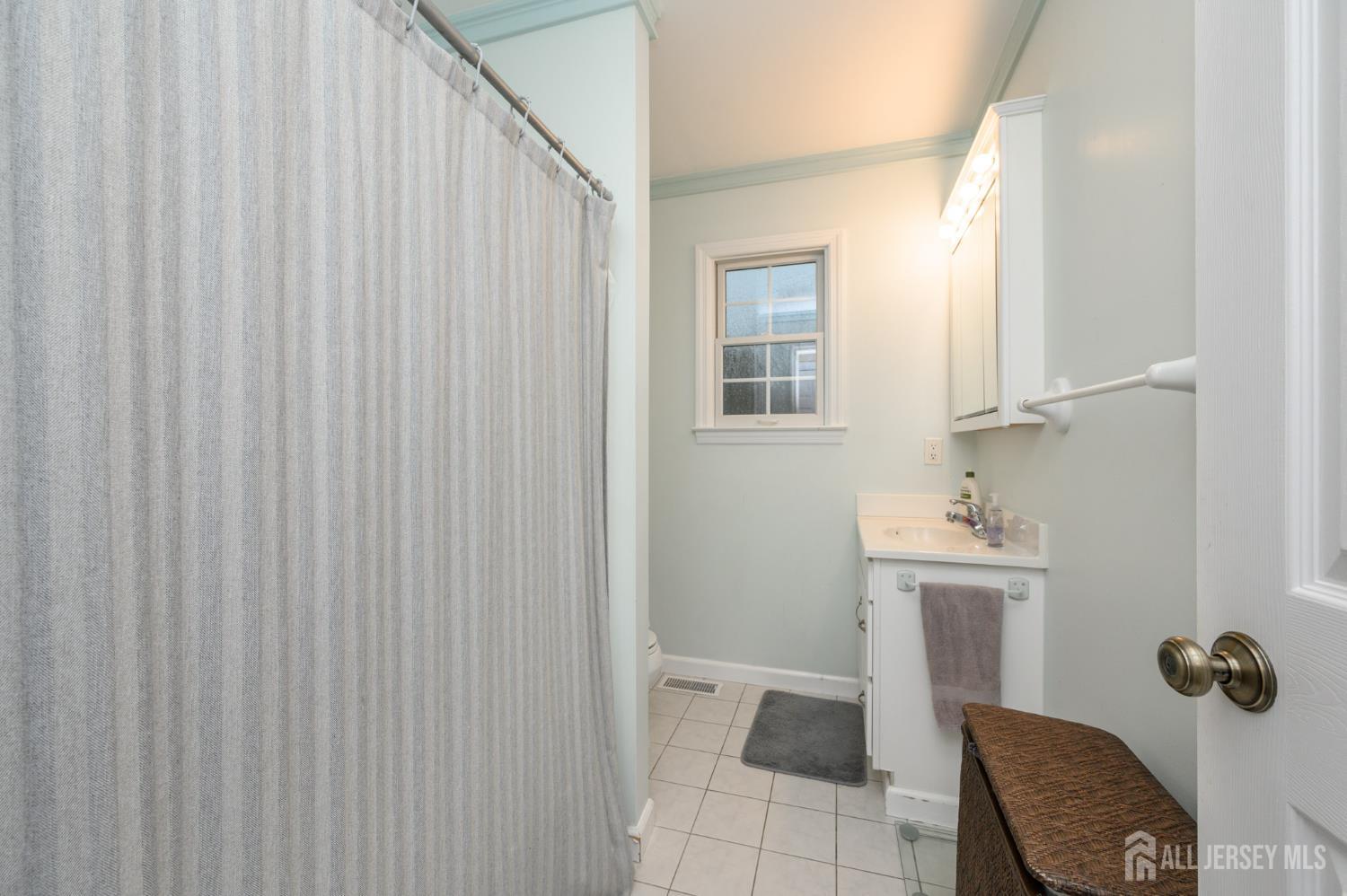 12 Diamond Lane Howell, NJ 07731 - Photo 33 of 47 a bathroom with a sink toilet and shower