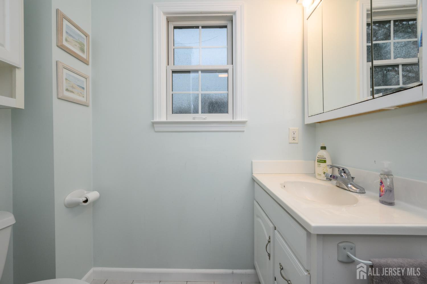 12 Diamond Lane Howell, NJ 07731 - Photo 34 of 47 a bathroom with a sink and a mirror