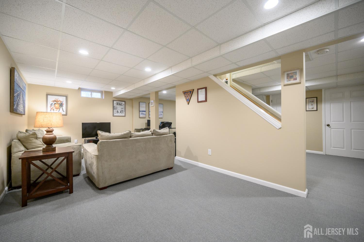 12 Diamond Lane Howell, NJ 07731 - Photo 36 of 47 a living room with furniture and a window