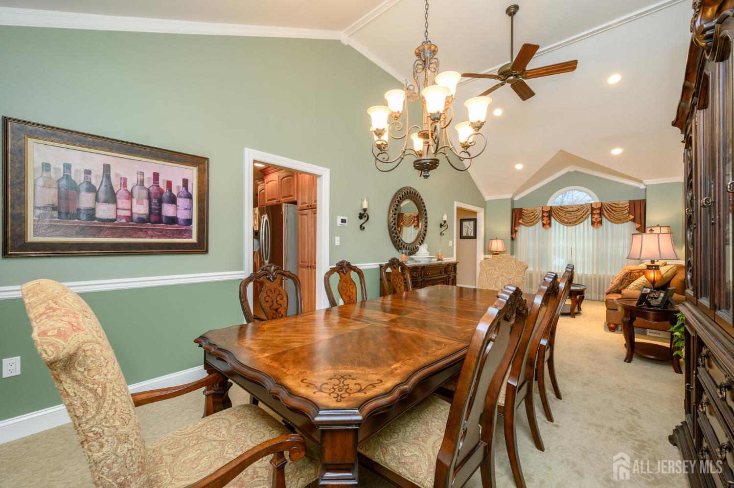 12 Diamond Lane Howell, NJ 07731 - Photo 8 of 47 a view of a dining room with furniture and a chandelier
