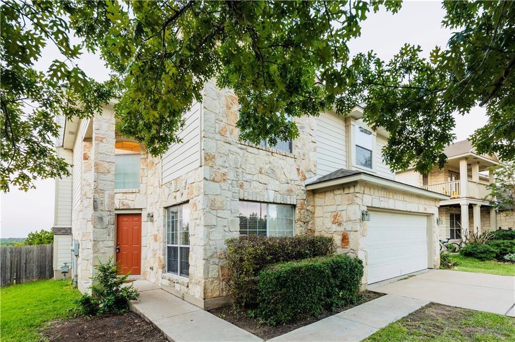 12017 Springs Head Loop Austin, TX 78717 - Photo 3 of 25 Stone and siding create an appealing facade for this inviting home, complete with an integrated garage.