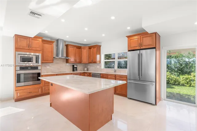 a bedroom with a bed and a large mirror