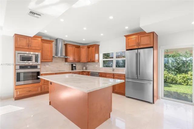 a bedroom with a bed and a large mirror