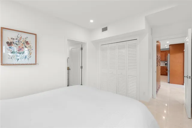 a kitchen with stainless steel appliances granite countertop wooden cabinets a sink and a large window