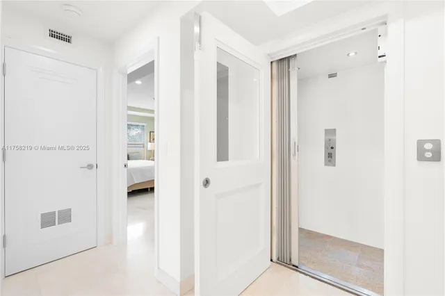 a bedroom with a large bed and a large window