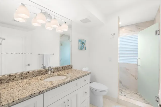 a large white bed in a white room