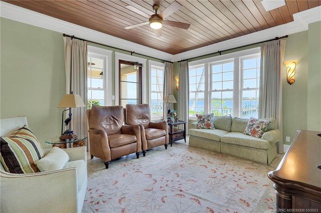 a bedroom with a bed and a table