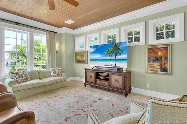 a view of a dining room with furniture wooden floor and a window