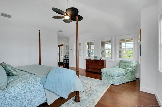 a kitchen with stainless steel appliances granite countertop a sink and a refrigerator