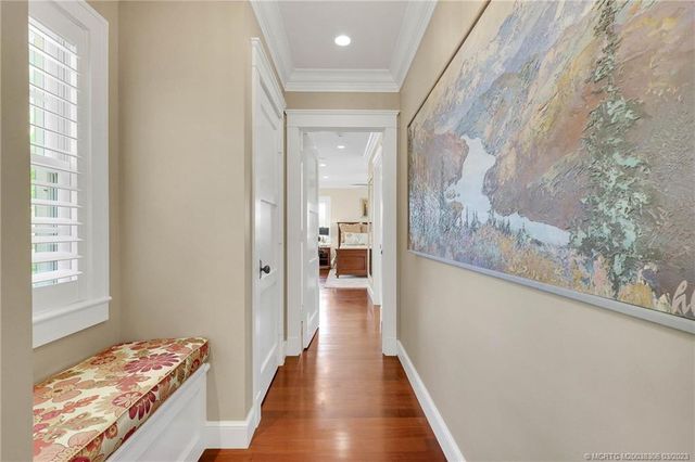 a living room with furniture and wall painting