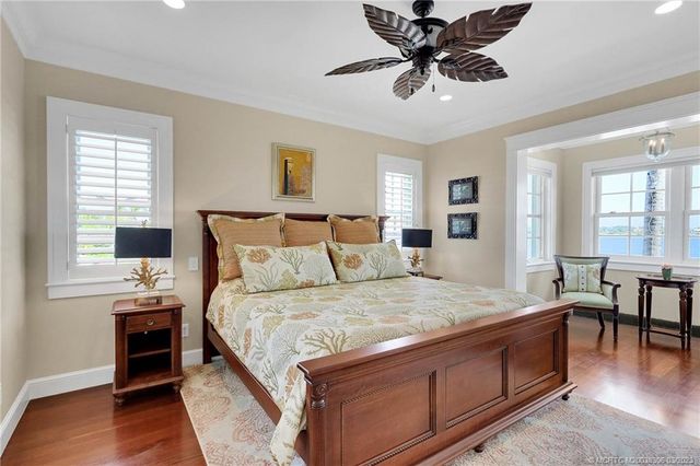 a bathroom with a granite countertop toilet sink and mirror