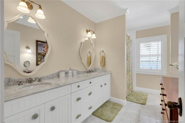 a kitchen with a white cabinets and white appliances