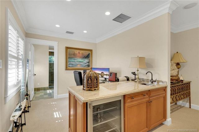 a view of a swimming pool with a garden and plants