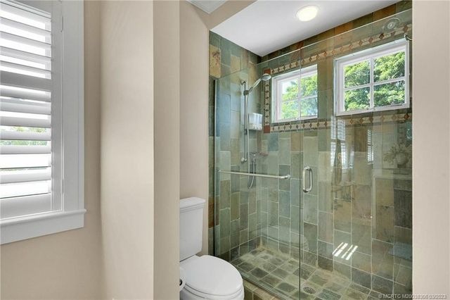 a view of a balcony with chairs