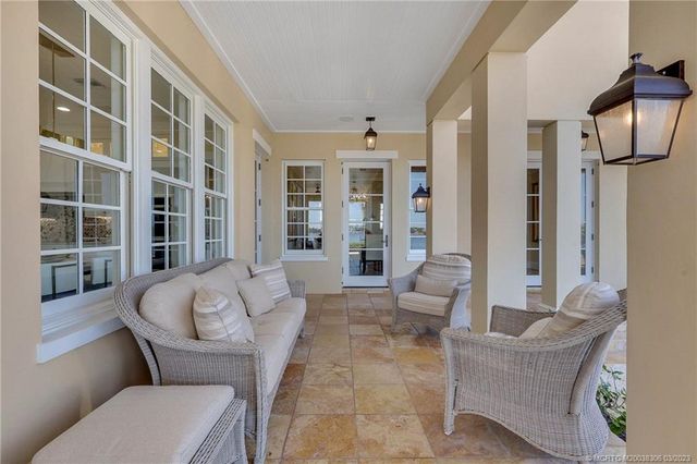 an aerial view of residential houses with outdoor space and swimming pool
