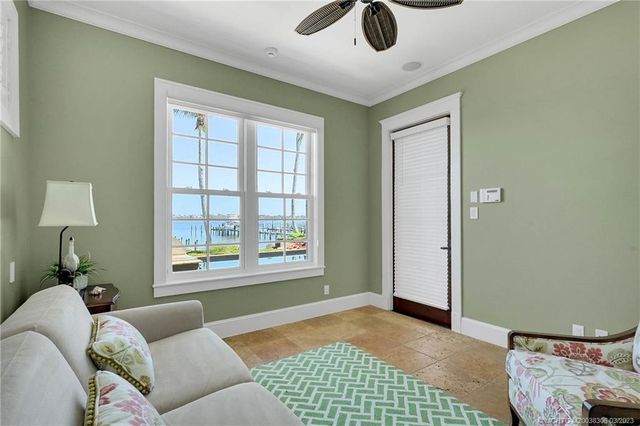 an aerial view of a chairs and table on the patio