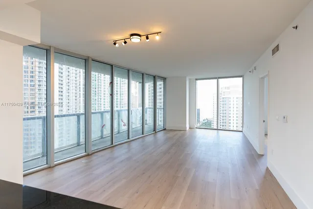 a bathroom with a sink a toilet a mirror and vanity