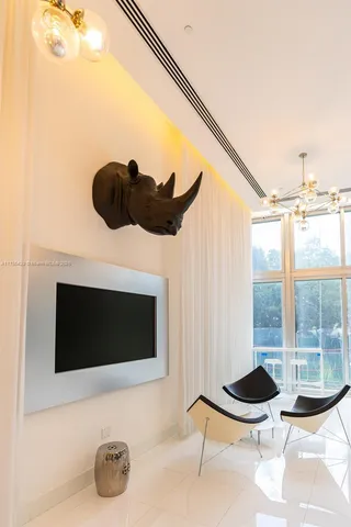 a kitchen with granite countertop a sink cabinets and stainless steel appliances