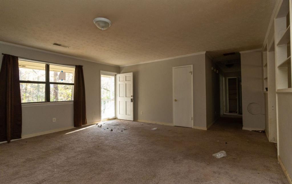 137 Springvalley Circle Stockbridge, GA 30281 - Photo 2 of 4 a view of an empty room with a window
