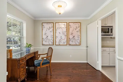 a view of a dining room with furniture and a window
