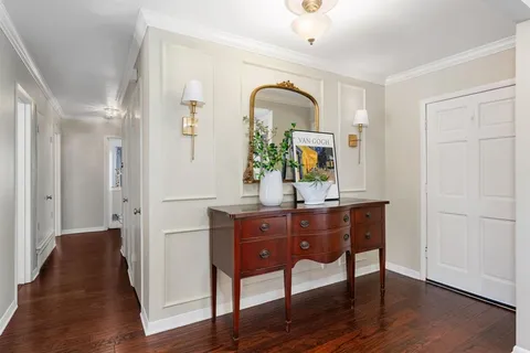 a view of living room with chair and wooden floor