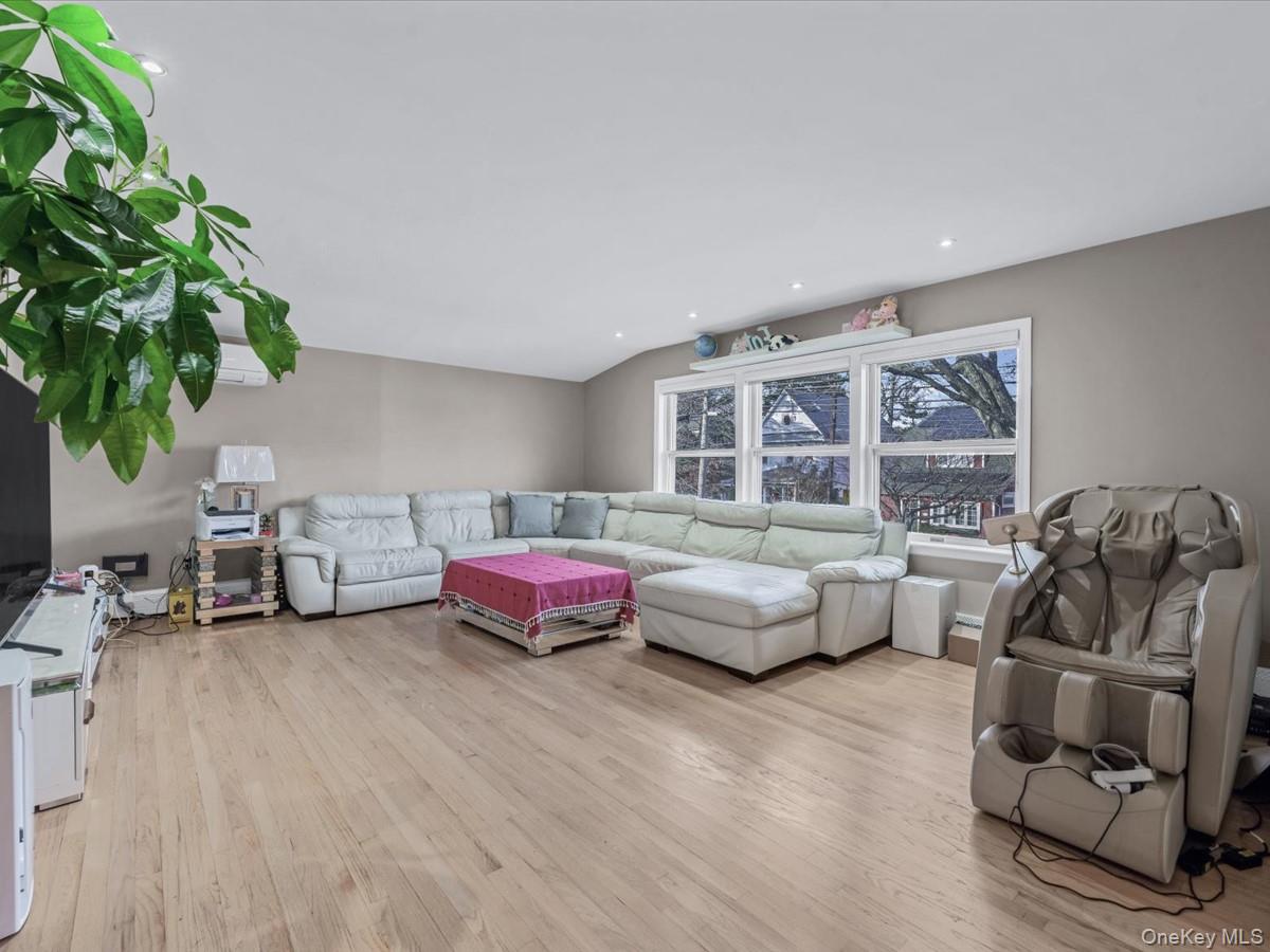 217-32 Corbett Road Queens, NY 11361 - Photo 5 of 25 Living area with light wood-type flooring and recessed lighting