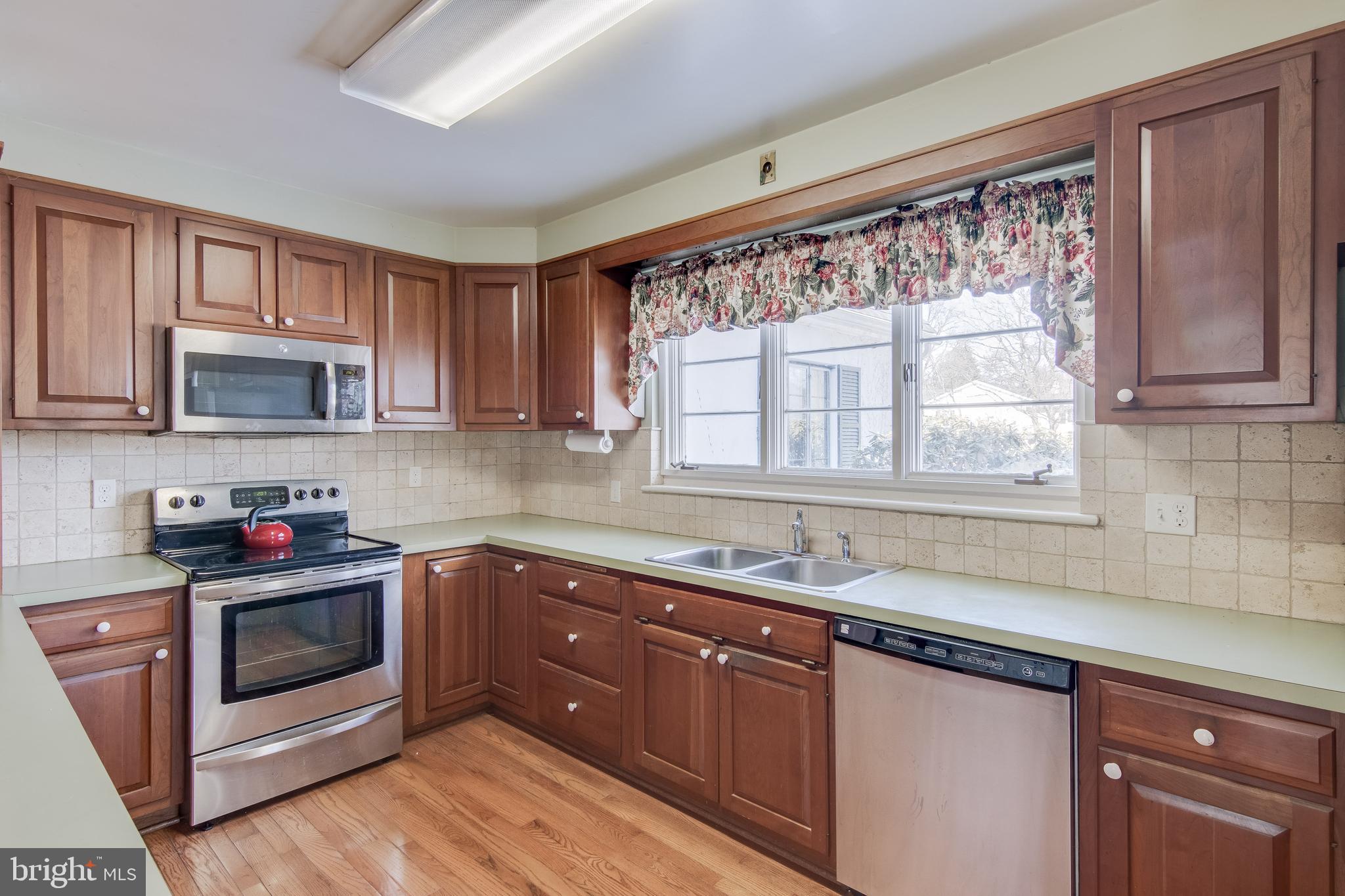 121 West Ring Factory Road Bel Air, MD 21014 - Photo 8 of 46 Wood cabinets and stainless steel appliances.