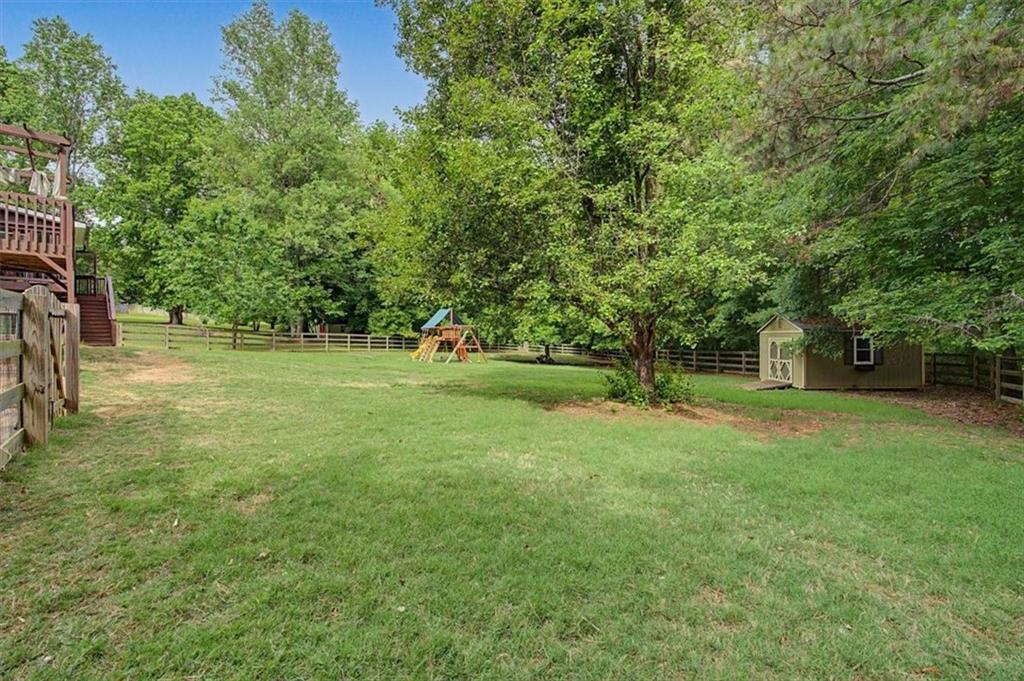 409 Windsor Way Canton, GA 30115 - Photo 36 of 51 a view of a tree in a yard